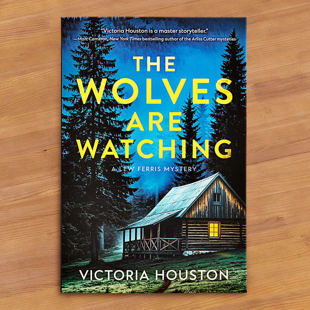 "The Wolves Are Watching: A Lew Ferris Mystery" by Victoria Houston