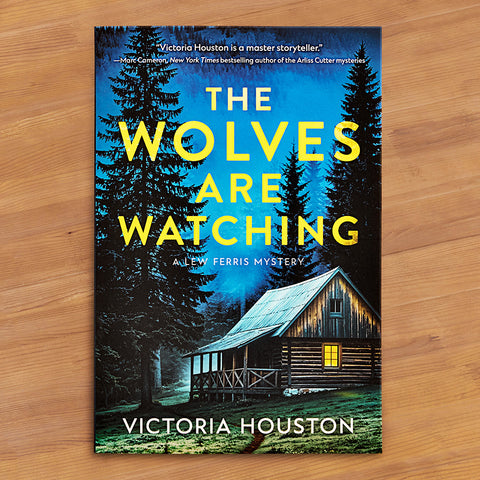 "The Wolves Are Watching: A Lew Ferris Mystery" by Victoria Houston