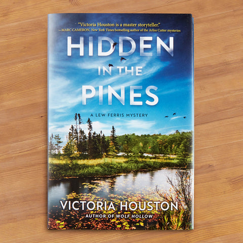 "Hidden in the Pines: A Lew Ferris Mystery" by Victoria Houston